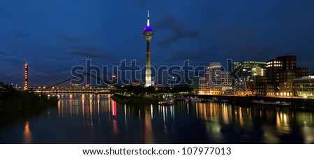 DUSSELDORF, GERMANY - JUNE 22: Evening panorama of the Media Harbor on June 22, 2012 in Dusseldorf, Germany. The Media Harbor is the most popular destination for architectural tourism in the city.