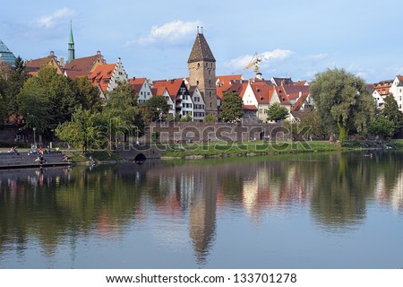 Ulm, view on Danube River, old City Wall (Shaufermauer) and leaning Butcher\'s Tower (Metzgerturm), Germany