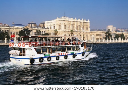 ISTANBUL, TURKEY - NOVEMBER 22, 2009: Cruise boat TurYol near the Dolmabahce palace. A private boat owners\' cooperative named TurYol operates frequent 1.5-hour Bosphorus cruise routes in Istanbul.