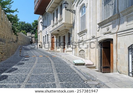 BAKU, AZERBAIJAN - AUGUST 23, 2014: Kicik Qala Street and fortress wall of the Baku Old City. On this place was filmed episode \