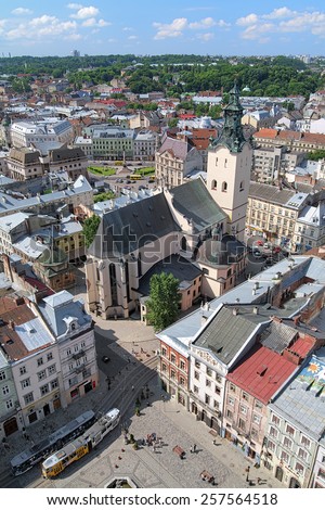 LVIV, UKRAINE - JULY 10, 2010: View of Latin Cathedral and corner of Rynok Square from City Hall. The Cathedral was founded in 1360 by the king Casimir III of Poland and finally consecrated in 1481.