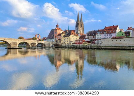 View from Danube on Regensburg Cathedral and Stone Bridge in Regensburg, Germany