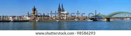 Large panorama of Cologne with Great St. Martin Church, Cologne Cathedral, Hohenzollern Bridge and the Rhine river, Germany