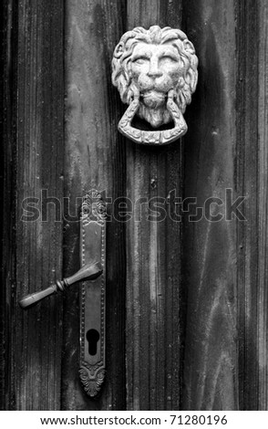 Old wooden door detail with handle and knob