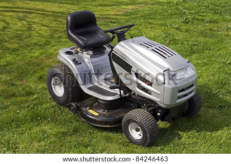 Small tractor for cutting lawn.