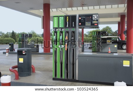 Filling station. Filling of cars by fuel.