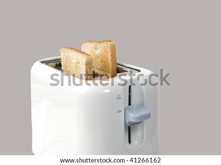 Loaf processing on toaster on grey background