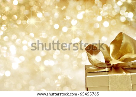 Golden gift on defocused lights background