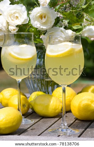 Cocktails with lemons served in the garden