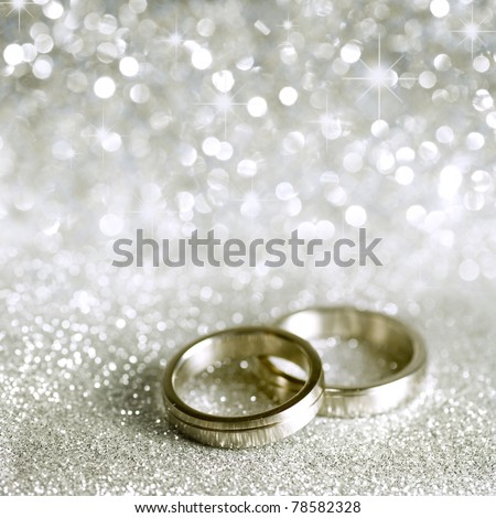 stock photo Beautiful silver background with wedding rings and stars