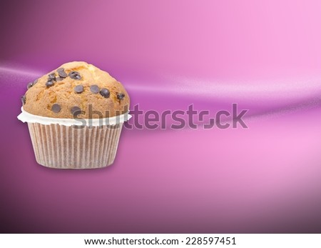Pink wallpaper with a chocolate muffin and empty space