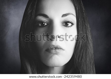 Black and white closed portrait of the face of a woman