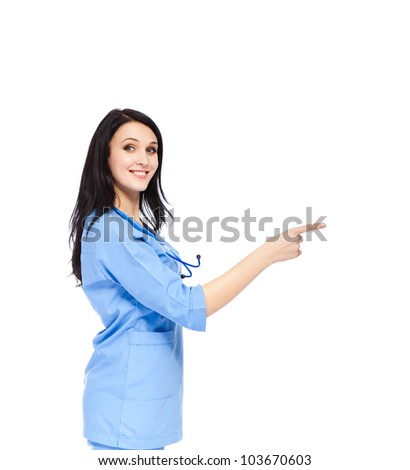 medical doctor woman smile with stethoscope, nurse wear blue surgery suit, point finger to side, concept of advertisement product, empty copy space. Isolated over white background