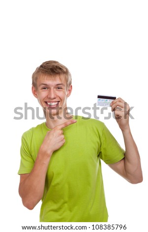 young happy excited smile man holding credit card point finger, handsome guy wear green shirt, isolated over white background