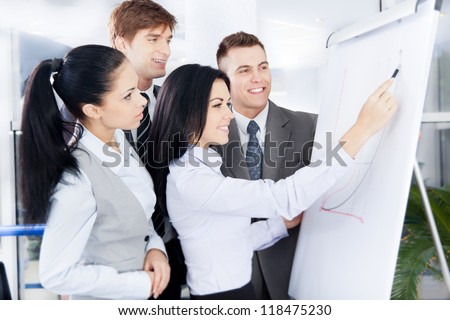 Group of business people team looking draw chart on white board, businesspeople presentation woman explaining graph diagram on whiteboard to colleagues in office