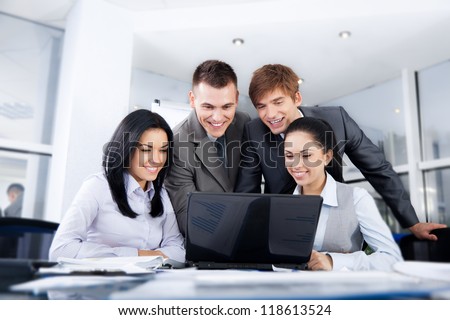 Group of business people working on laptop, looking at screen meeting at office desk work together, businesspeople colleague team sitting using computer discussing report