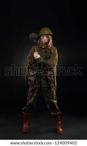army girl hold shovel, soldier woman in a military uniform full length over black background
