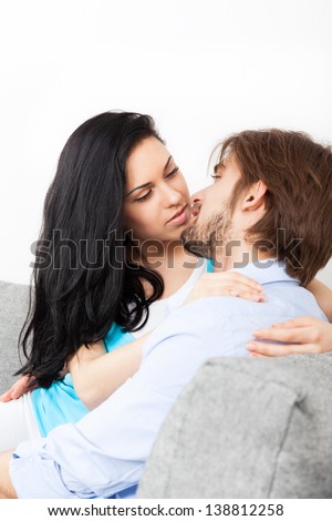 couple lover kiss on couch, young lovely woman kiss man, romantic love date embrace on the sofa