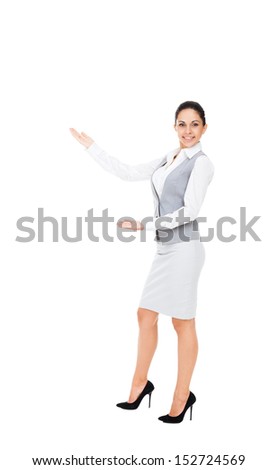 Businesswoman smile hold open palm with empty copy space, business woman showing hand sign to side, concept of advertisement product. Full length isolated over white background