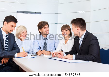 business people discussion on meeting, businessmen smile talking laughing, happy group businesspeople team sitting at desk in office, communicate