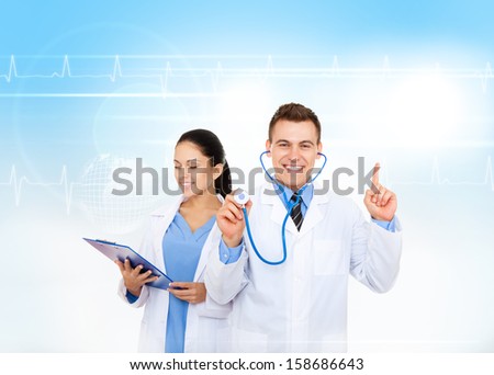medical team doctor, man smile show point finger up to copy space advertisement product, wear white lab coat stethoscope over abstract blue medic health care background
