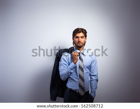 Fashion business man, Handsome male model blue shirt and tie suit, young businessman over gray background