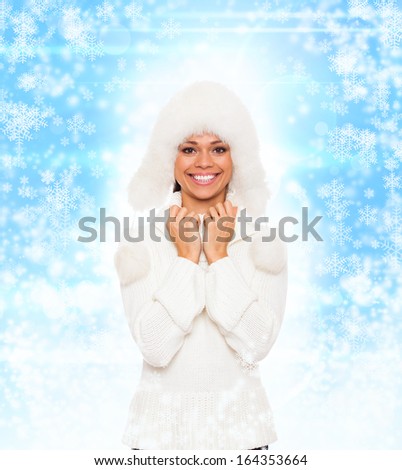 winter woman happy smile, young excited girl wear warm sweater and hat, abstract christmas ornament with blowing snow flake blue background