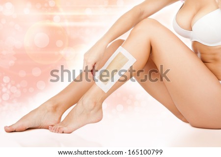 Depilation women legs, spa with waxing, girl doing wax epilation beauty over abstract flower background