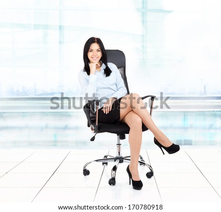 Smiling Business Woman Sitting In Chair Modern Office Building. Young Businesswoman Smile