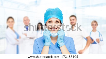 medical doctor surgical woman excited smile with team group of people in hospital, nurse wear blue surgery suit gloves mask cap