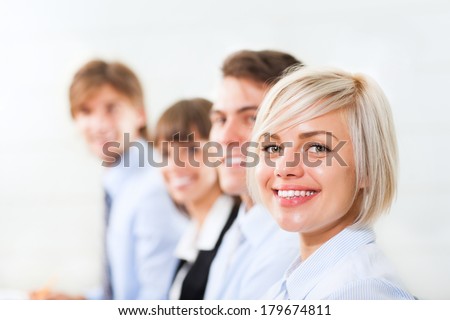 happy smile business woman face, people group in a row, young businesswoman looking at camera, businesspeople team sitting at desk in office