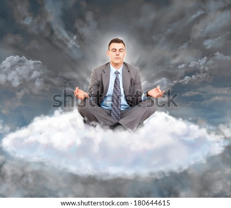 business man meditate sitting on white cloud closed eyes yoga zen pose over dark storm clouds, businessman wear suit and tie, concept