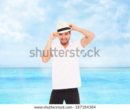 handsome fashion man in hat, smile, concept of travel summer vacation over sea blue sky, ocean