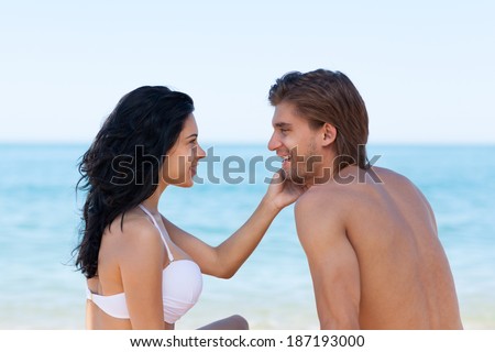 Love romantic couple beach summer, woman and man look each other face to face, ocean vacation holiday travel