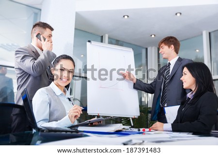 Group of business people team looking draw chart on white board, businesspeople presentation woman explaining graph diagram on whiteboard to colleagues in office