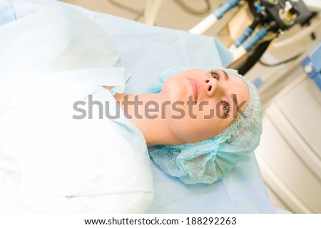 beautiful female patient operation, woman lying in surgery room hospital
