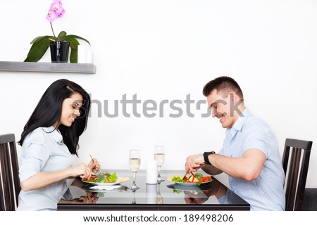 Young couple dinner at table, eat food, romantic date at restaurant, home or cafe