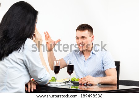 couple conflict, dinner sitting at table young man and woman relationships problem, negative argue, at home or restaurant