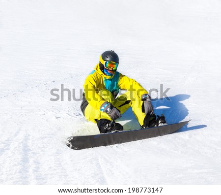 Snowboarder sitting on snow mountains, snowboarding slopes