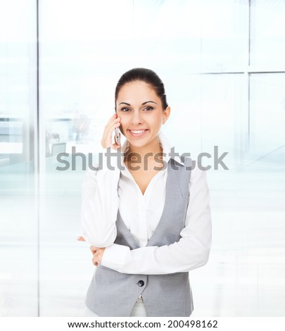 business woman smile cell phone call, talking on mobile cellphone, young businesswoman in modern office