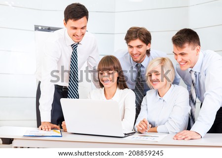 business people working looking to laptop screen, discussion on meeting, happy group businesspeople smile, team cooperation sitting at desk in office, communicate