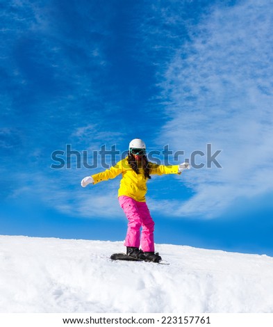 Snowboarder woman sliding down hill, snow mountains snowboarding on slopes