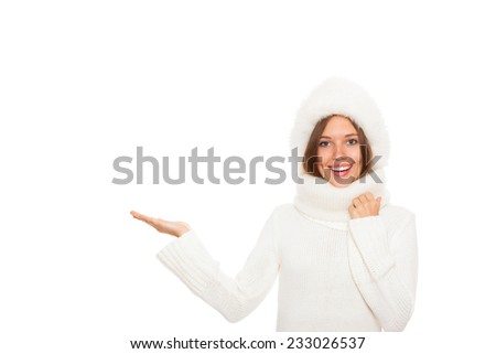 winter woman happy smile hold open palm showing side empty copy space, young girl wear sweater and hat, advertisement product isolated over white background