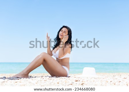 woman cell phone call smile sitting on beach summer vacation, young girl over sea blue sky, communication concept ocean holiday travel