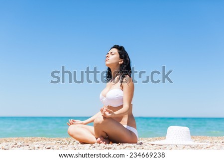 woman sitting beach yoga lotus pose tanning, young girl sunbathing summer travel ocean vacation, female over sea blue sky, ocean