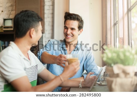 Two Men Cheers Toast Drink Friends Guys Happy Smile Sitting at Cafe Natural Light