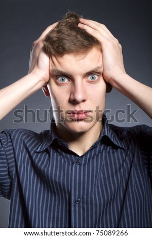 Man holding his head, stressed, headache, depressed.