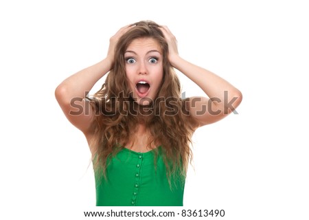 portrait of attractive surprised excited scared screaming teenage, hold hands on head, open mouth with brown long hair, isolated over white background concept of worried student, young pretty woman