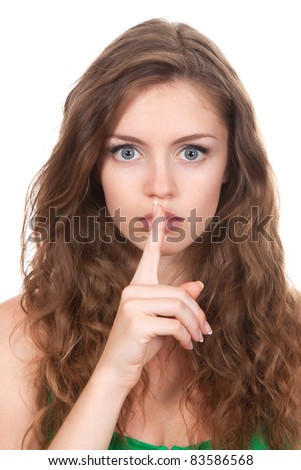  portrait of attractive teenage girl with finger on lips brown long hair