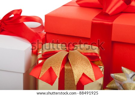 Holiday gift box background with red ribbon bow, close up view, isolated on white background